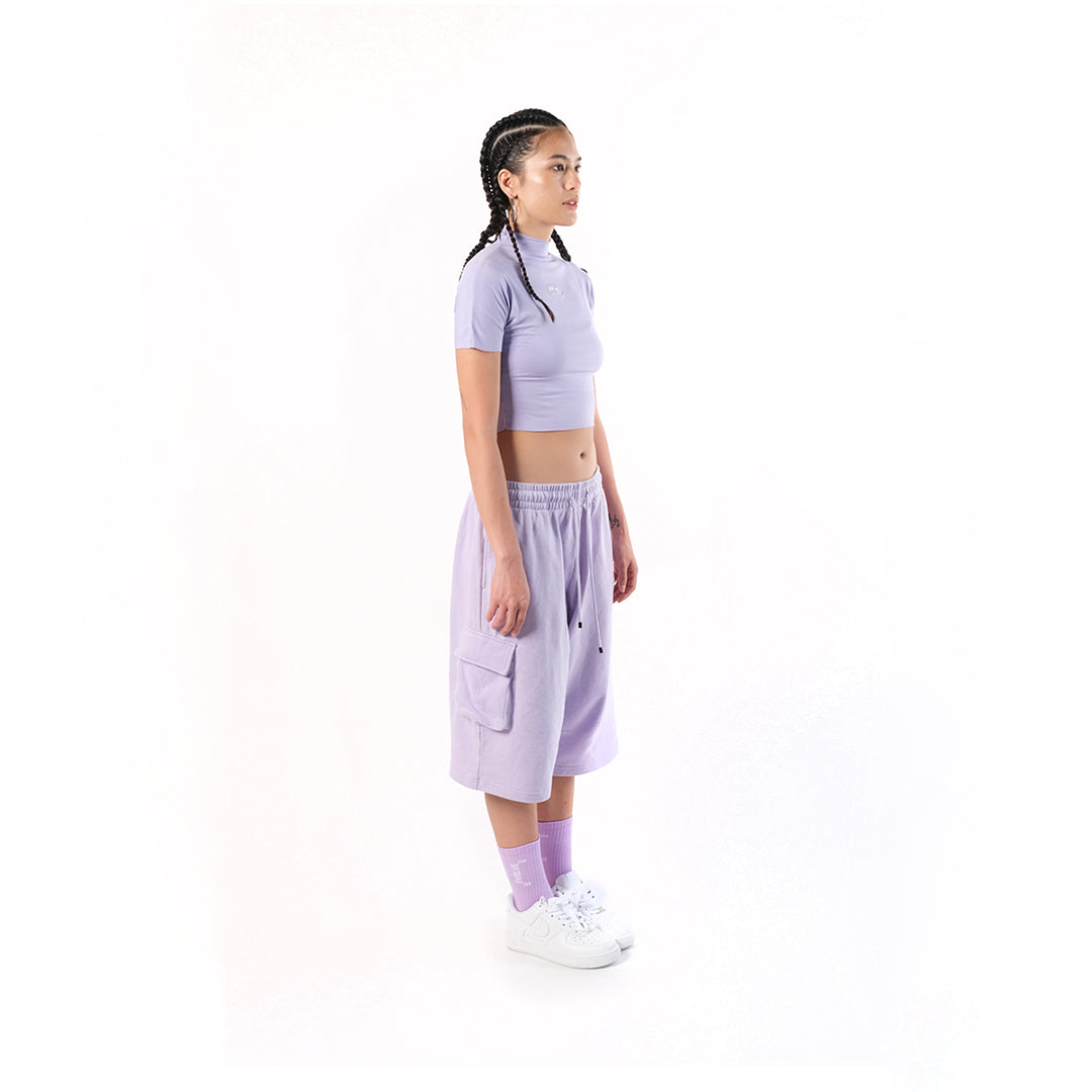 Gym Short Lilac or Digital Lavender. Cotton Baby Terry. Acid stonewashed. Two side pockets. Two back pockets. Drawstring at elasticized band. Cold machine wash. Unisex