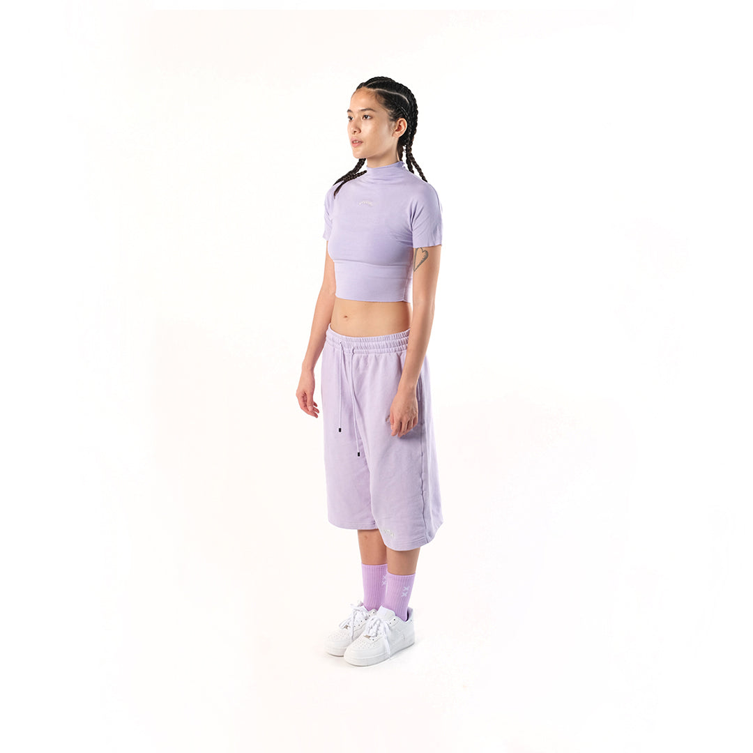 Gym Short Lilac or Digital Lavender. Cotton Baby Terry. Acid stonewashed. Two side pockets. Two back pockets. Drawstring at elasticized band. Cold machine wash. Unisex