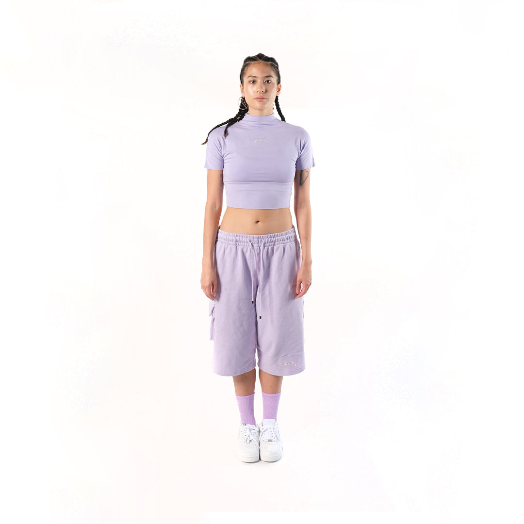 Gym Short Lilac or Digital Lavender. Cotton Baby Terry. Acid stonewashed. Two side pockets. Two back pockets. Drawstring at elasticized band. Cold machine wash. Unisex